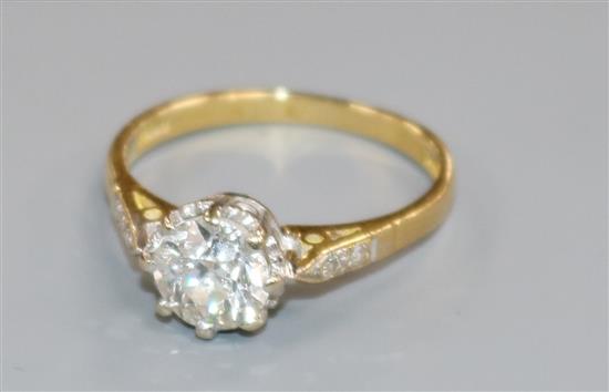 A diamond solitaire ring (approx 1.0ct), with diamond-set shoulders and 18ct gold shank, size L.